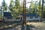 ranch home with cosmetic dormer over entry